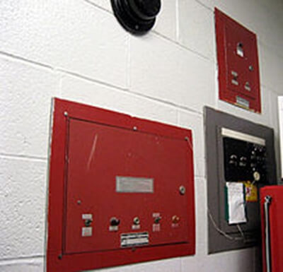 How does a conventional fire control panel system work?